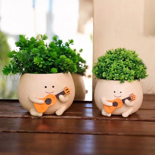My New Favorite Plant Buddies: The Ukulele-Playing Planters