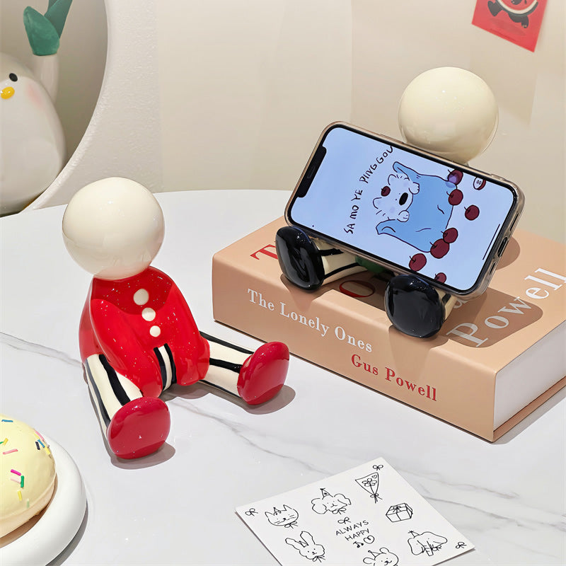Abstract Cartoon Doll Sitting Figurine Phone Stand - Fun Home&Office Desktop Decoration Small Ornaments